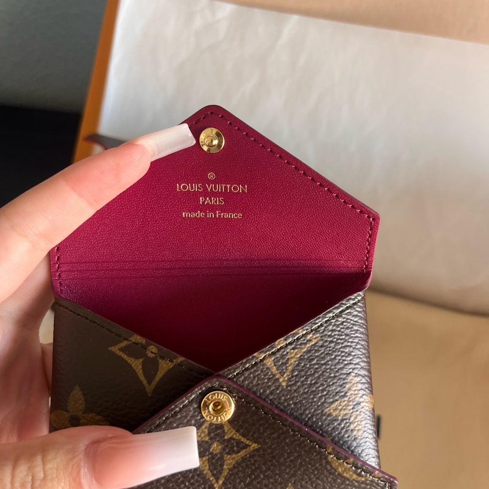 Louis Vuitton clutch and change purse